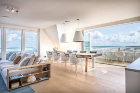 Super Luxe C-View appartement met zwembad en sauna op Duin aan Strand